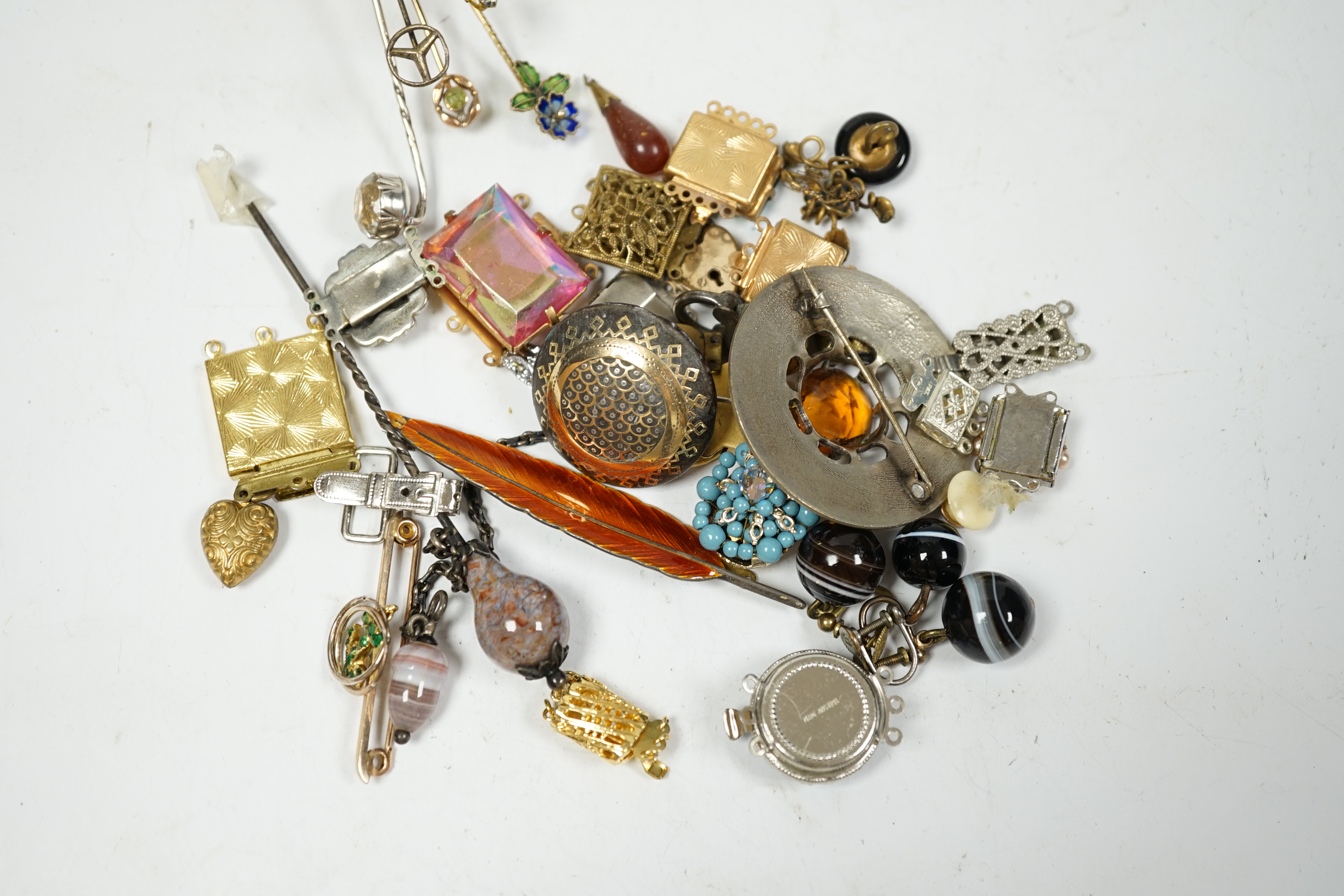 A small quantity of early 20th century and later jewellery, including a diamond chip set white metal pendant, an agate set hair? ornament and a 9ct and gem set anchor bar brooch, banded agate drop ear clips, stick pins,